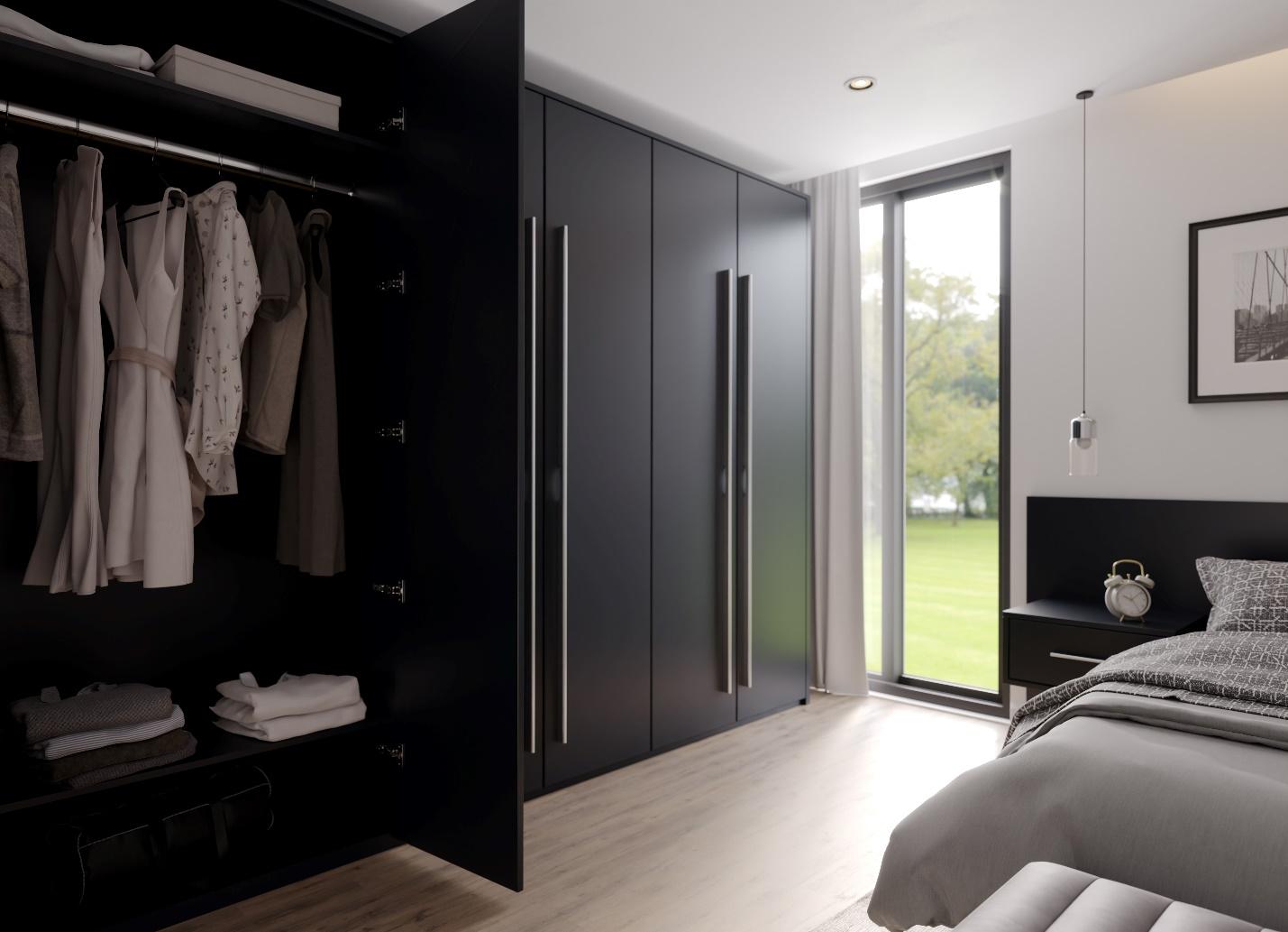 A room with black cabinets and a bed

Description automatically generated