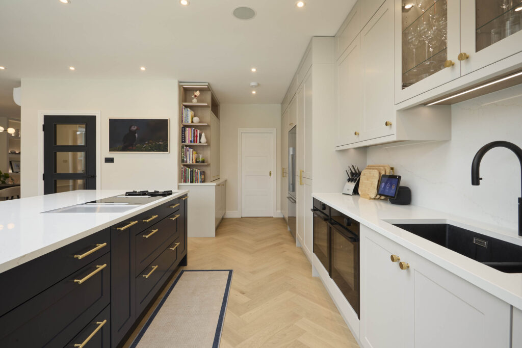 Contemporary kitchen featuring black-white cabinetry - Ashford Kitchens & Interiors